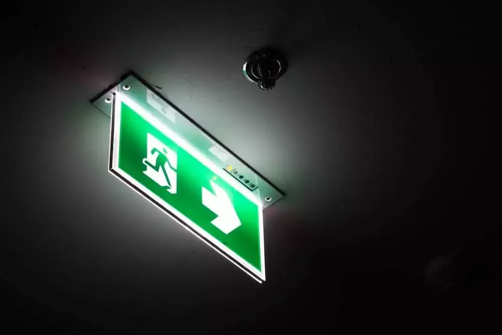 Emergency lighting installation in a commercial corridor